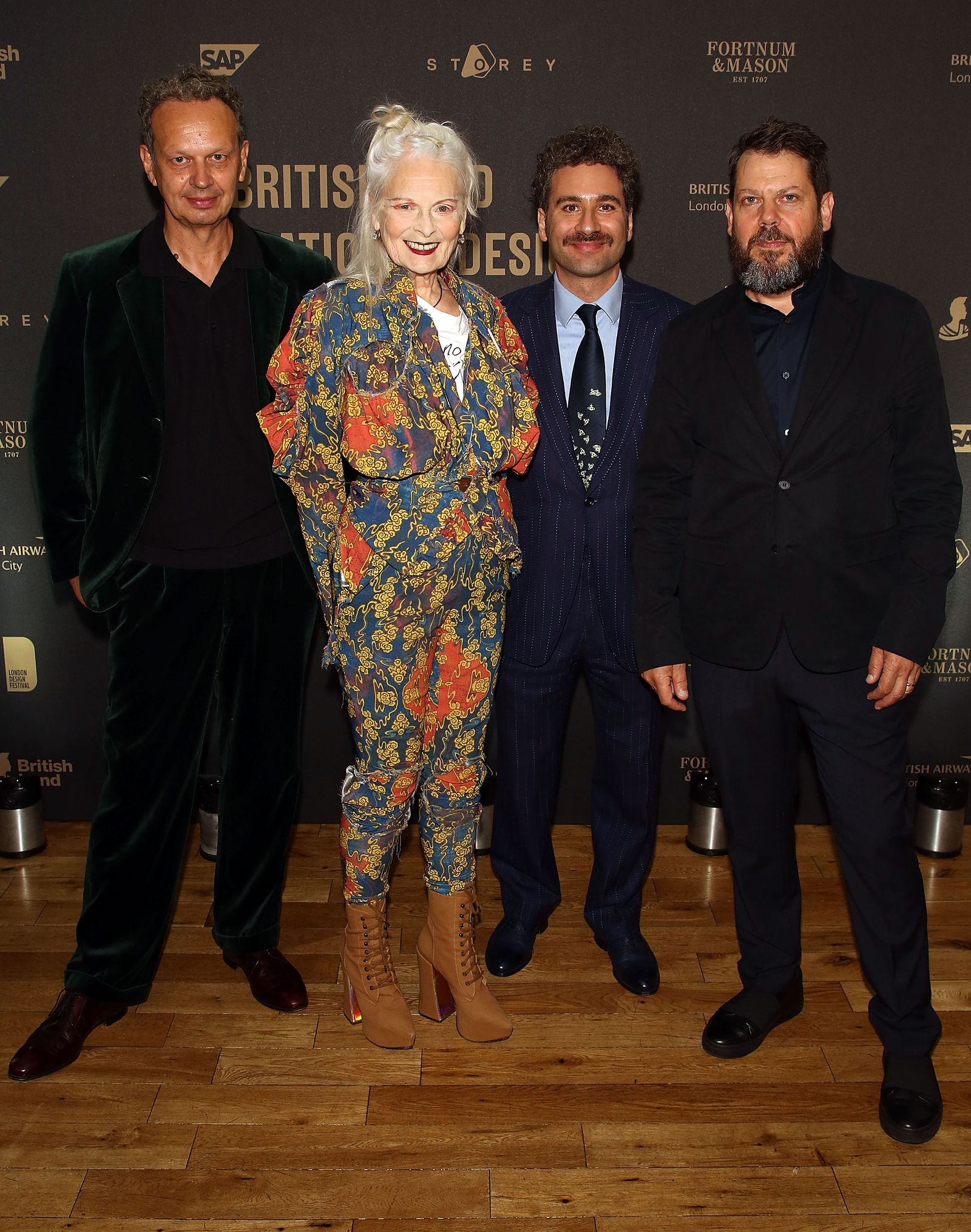 Image may contain Vivienne Westwood Human Person Fashion Tie Accessories Accessory Premiere Suit Coat and Clothing