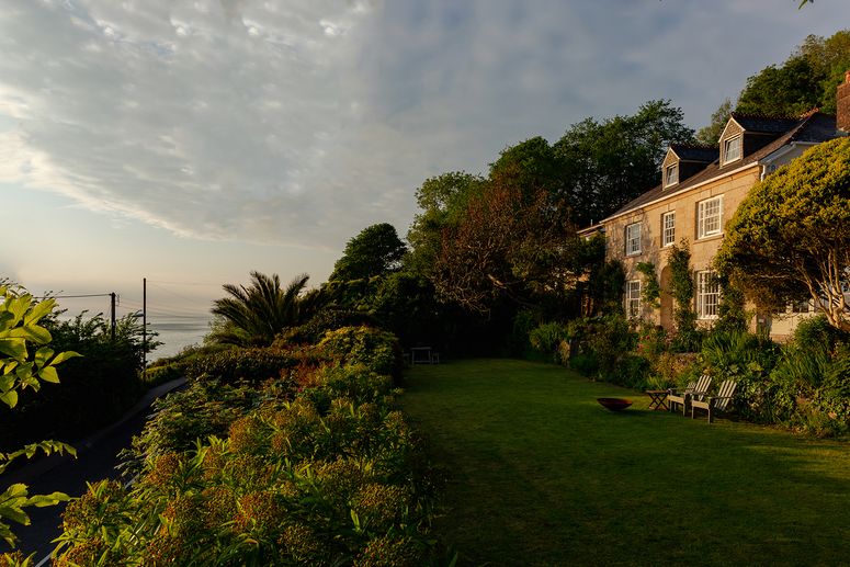 Image may contain: Plant, Grass, Lawn, Building, Outdoors, and Tree