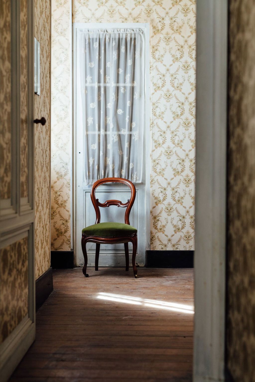 Image may contain Home Decor Furniture Chair Flooring Wood Floor and Hardwood