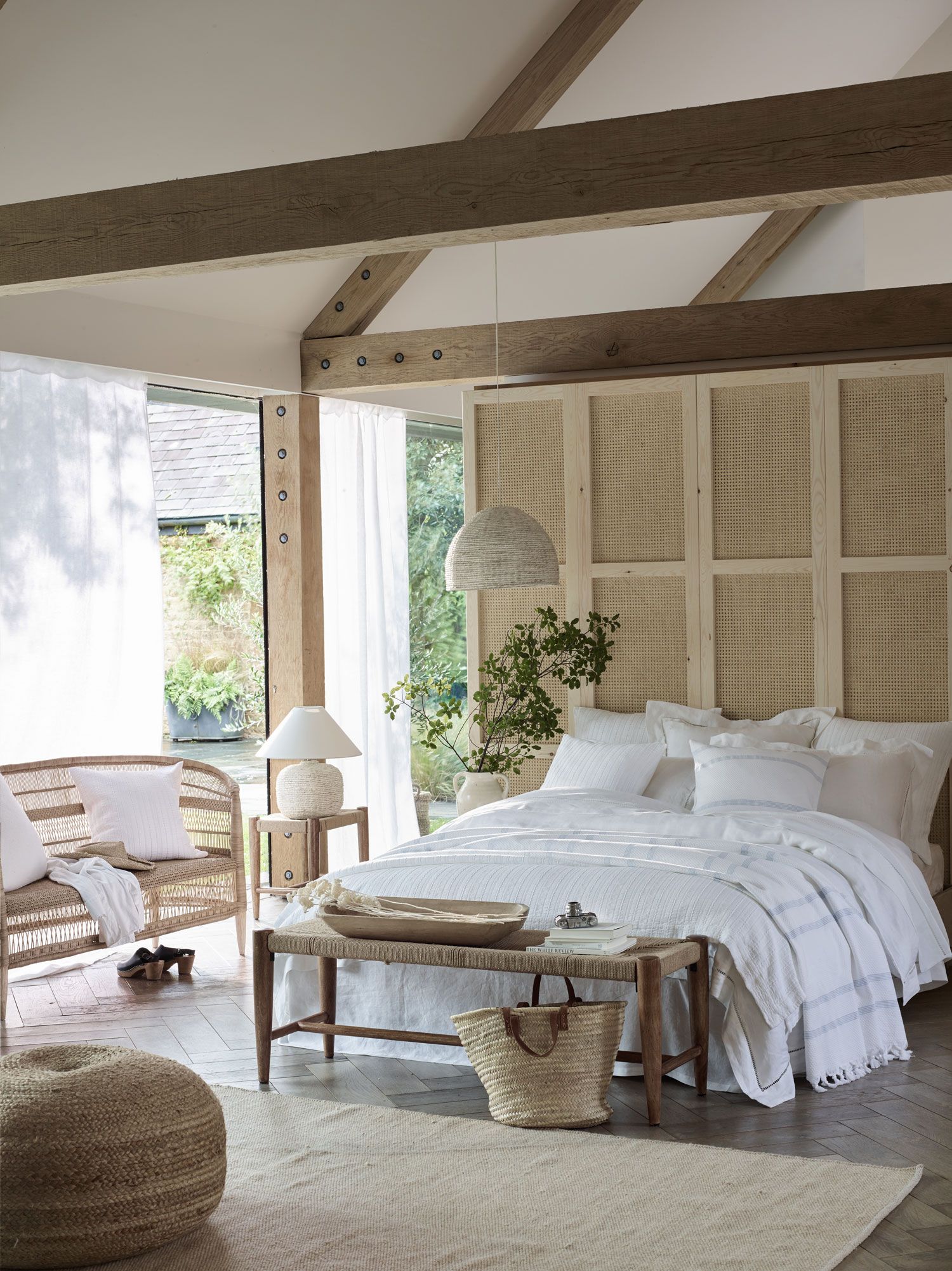 Image may contain Interior Design Indoors Furniture Room Bedroom Cushion Pillow Bed Rug Home Decor and Living Room