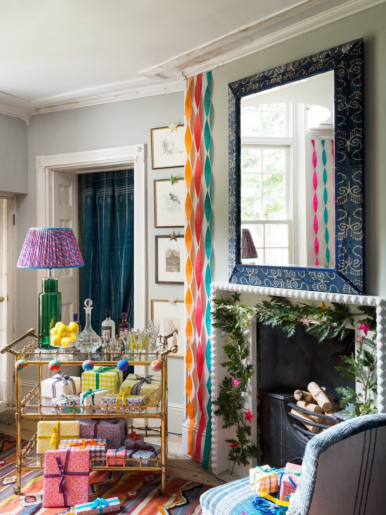 Image may contain Lamp Living Room Room Indoors Furniture Table Lamp Human and Person