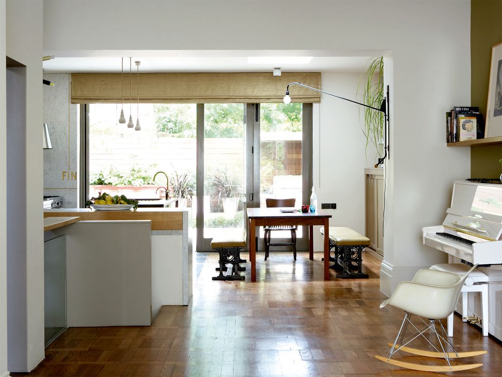 The flooring is old parquet tiles laid in interesting patterns.