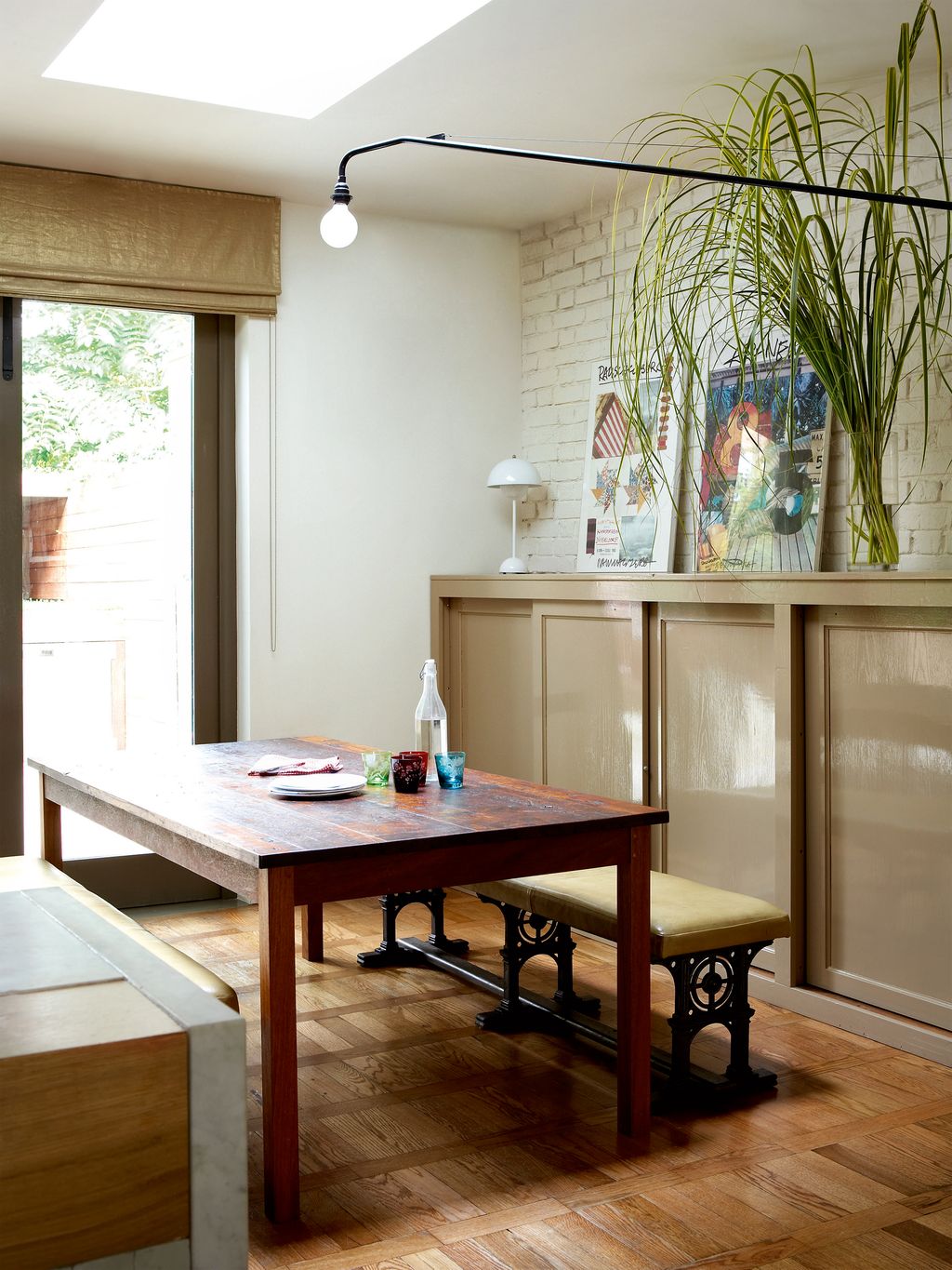 The table is made from a school laboratory worktop Maria adapted the cupboard which was found in a church to give it...