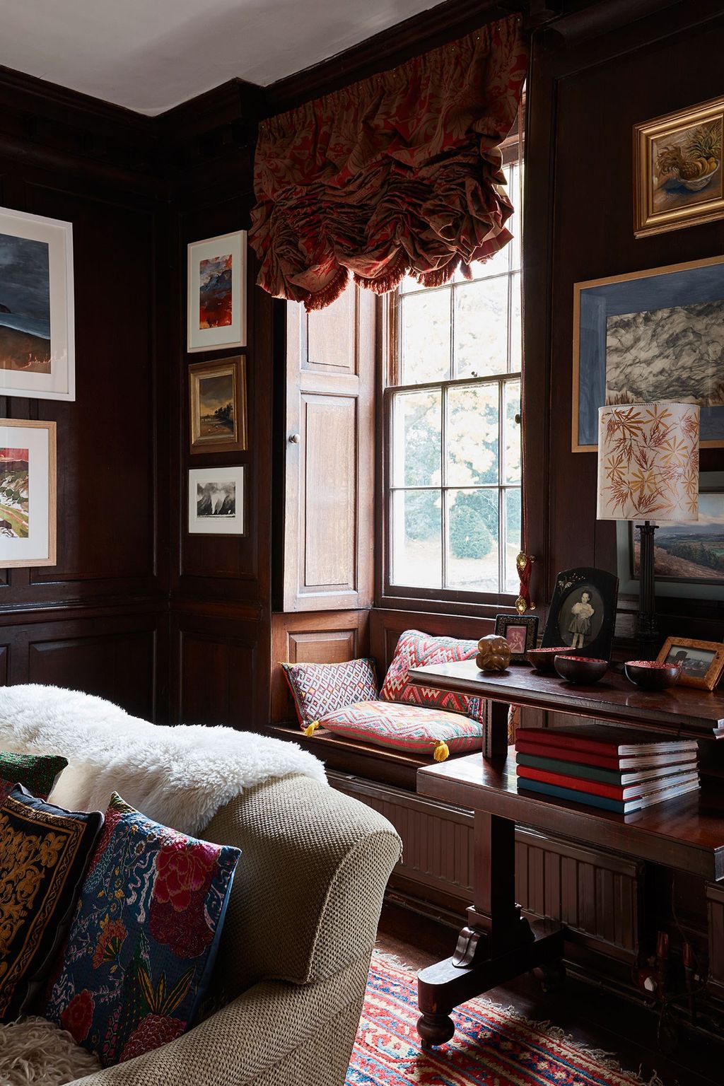 Image may contain Furniture Living Room Room Indoors Couch Cushion Pillow and Wood