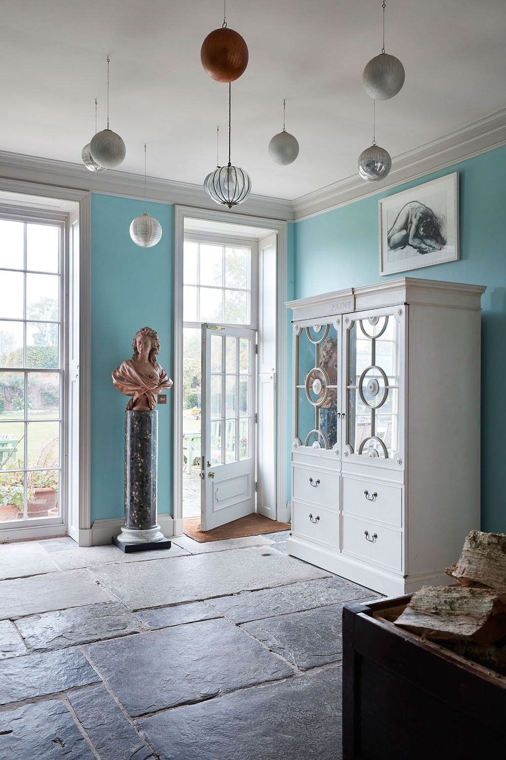 The flags on the floor here were taken from the demolished nineteenthcentury wing.