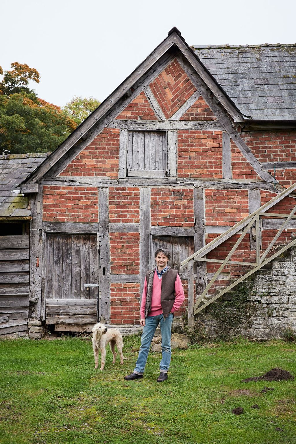 Image may contain Human Person Nature Outdoors Shelter Countryside Rural Building Housing Animal Pet and Canine