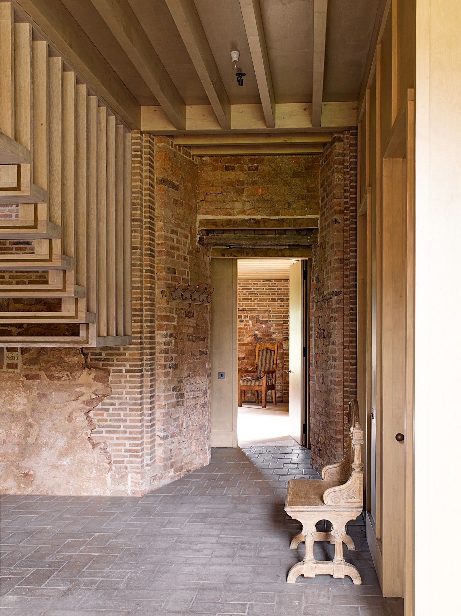 Image may contain Floor Flooring Wood Corridor and Flagstone