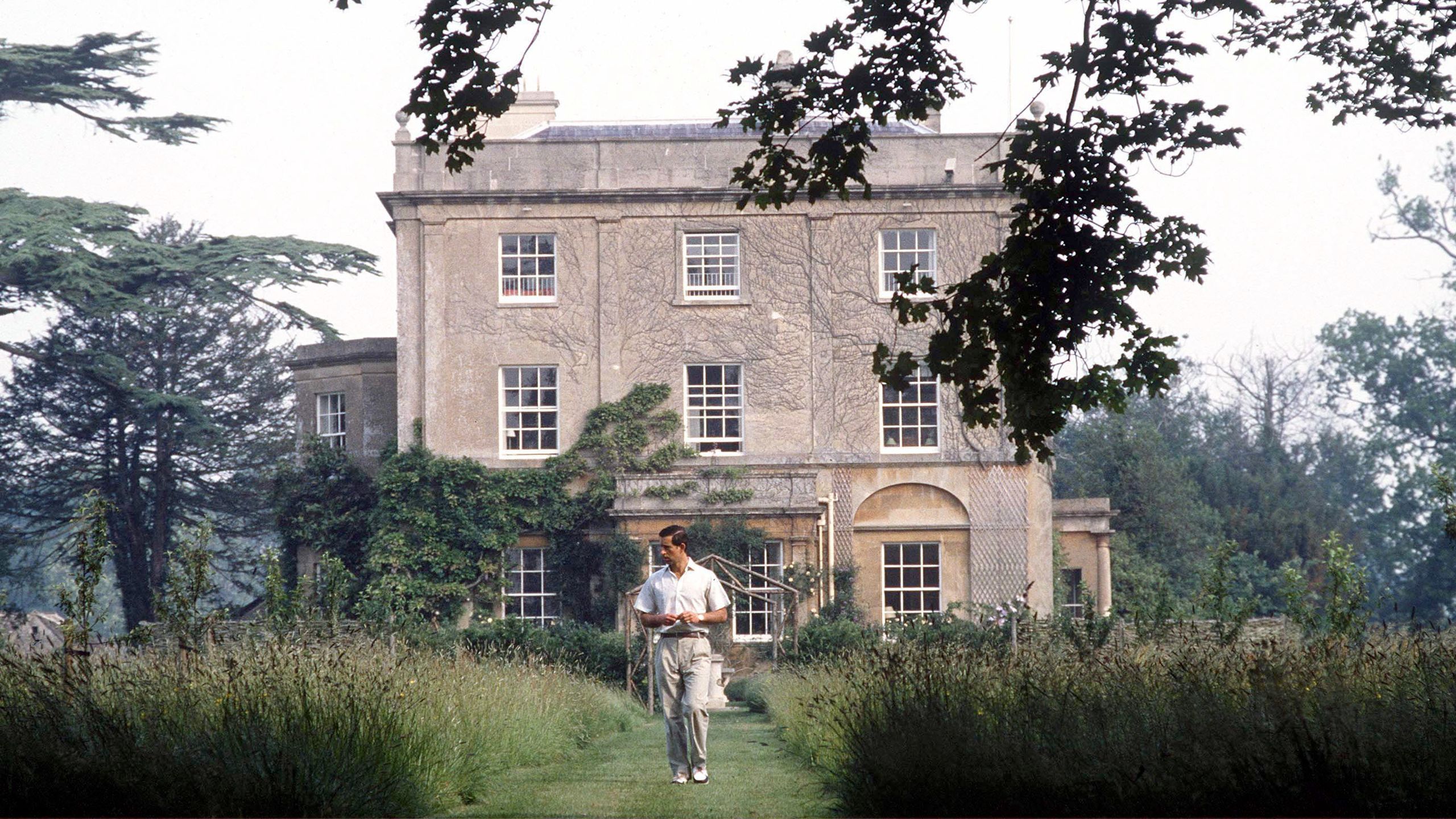 Image may contain Human Person Outdoors Housing Building Grass Plant Garden Villa House and Vegetation