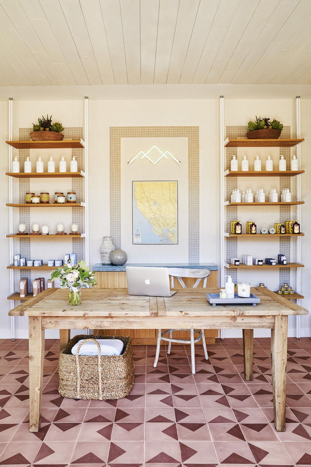 Image may contain Interior Design Indoors Shelf Furniture Room Wood Table Rug Living Room and Flooring