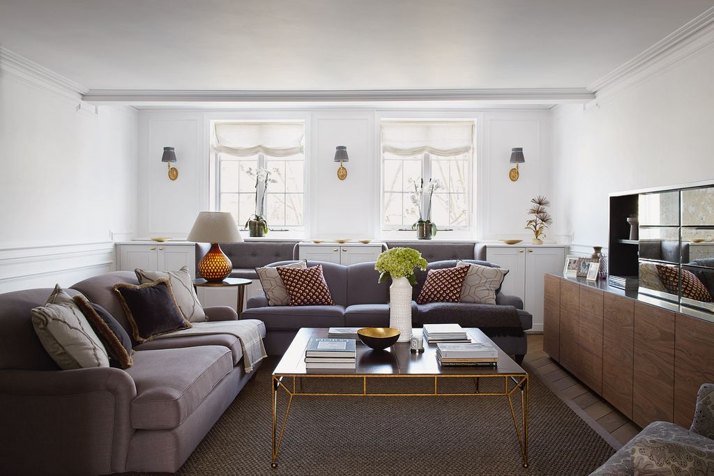 Image may contain Furniture Living Room Room Indoors Table Coffee Table Couch Interior Design Flooring and Rug