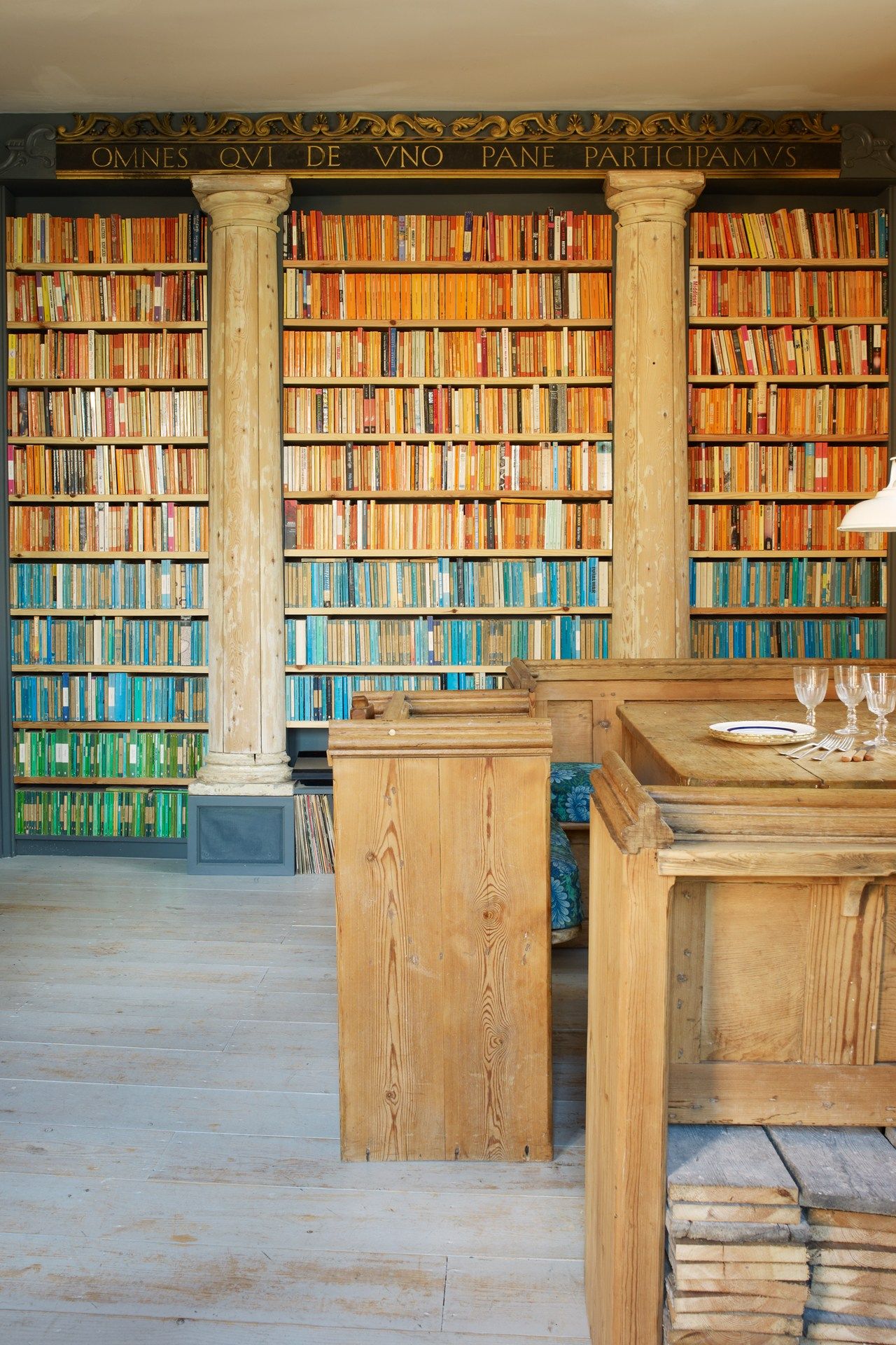 Image may contain Furniture Indoors Room Library Book Wood Interior Design and Bookcase