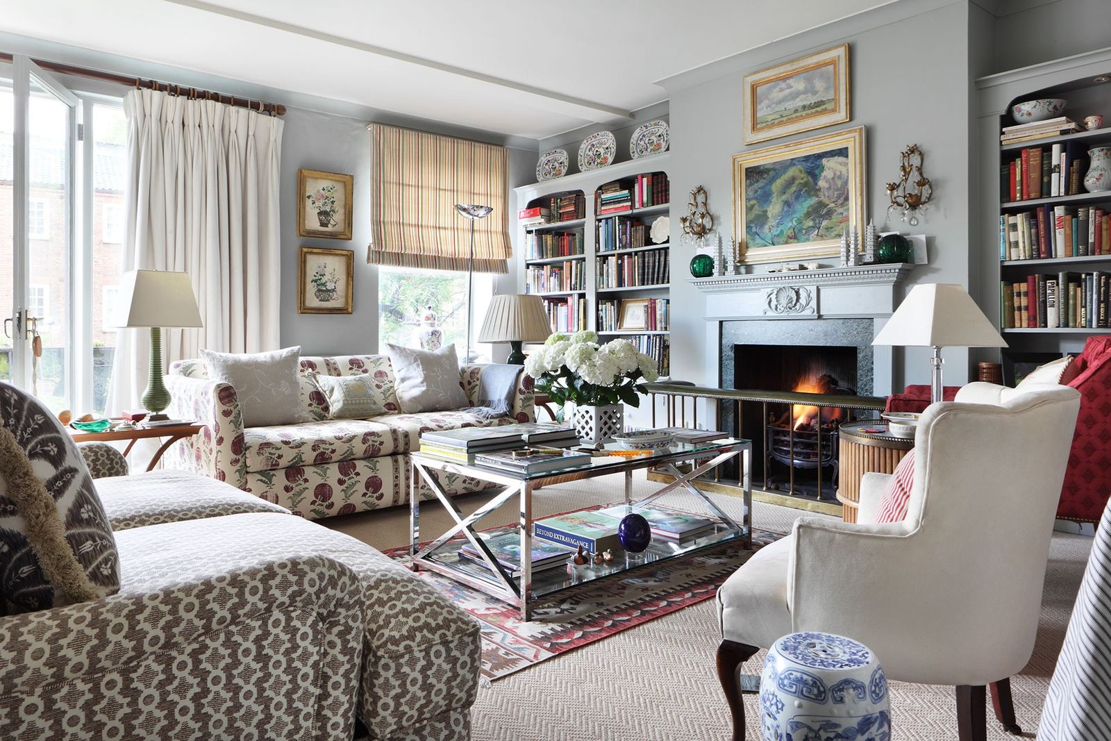 Image may contain Furniture Living Room Room Indoors Table Chair Coffee Table Couch Interior Design and Hearth