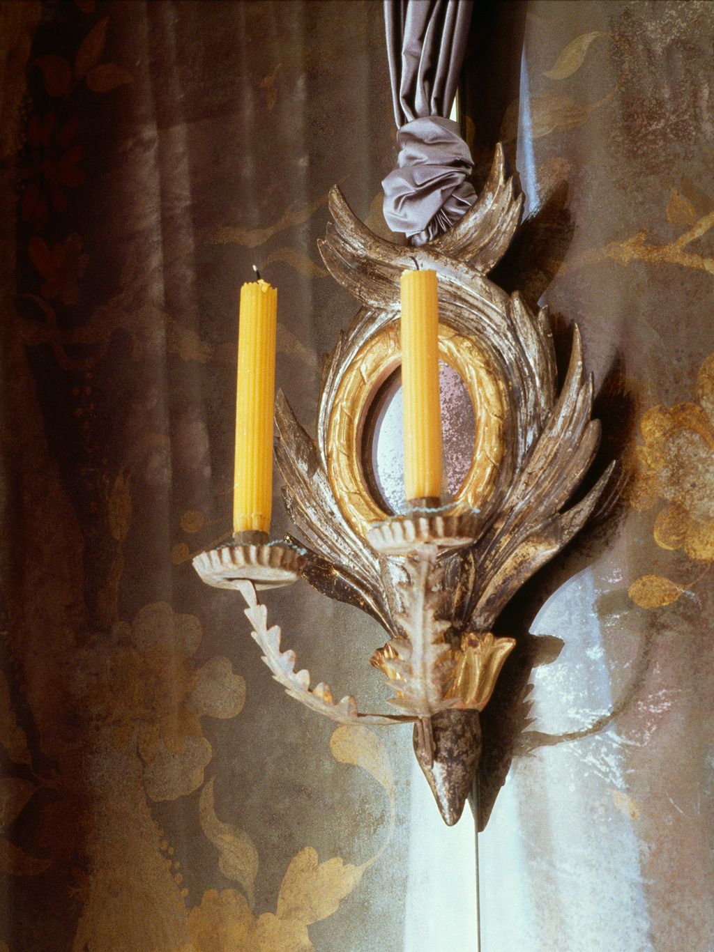 An eighteenthcentury neoclassicalstyle silverleaf and parcelgilt sconce in the salon was spotted by Nicholas Haslam in...