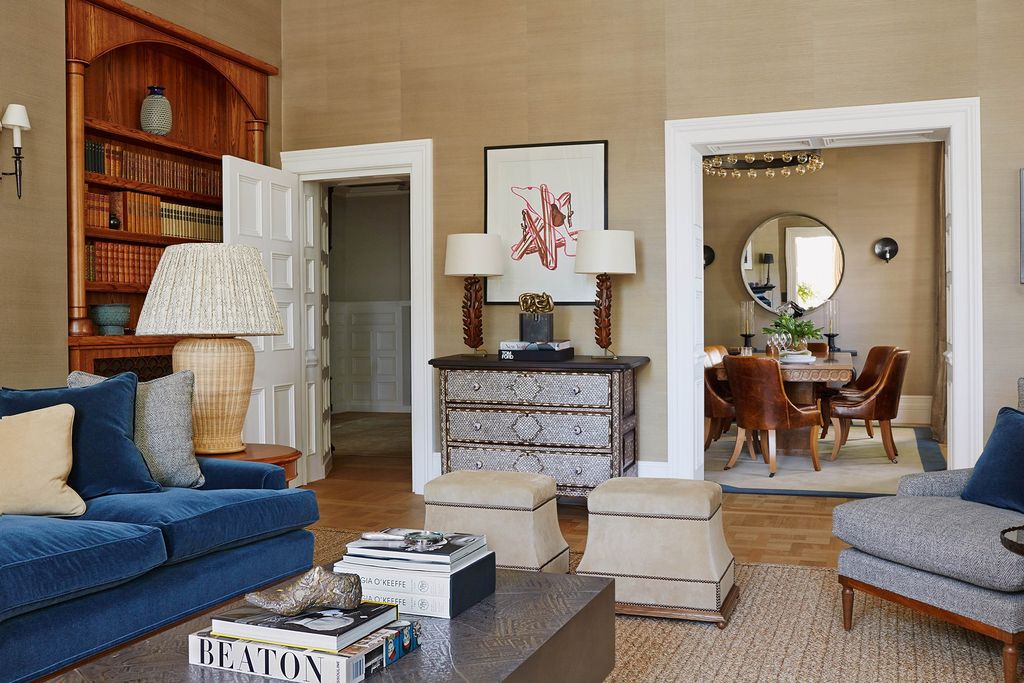 Image may contain Furniture Living Room Room Indoors Couch Chair Wood Table Hardwood Flooring and Interior Design