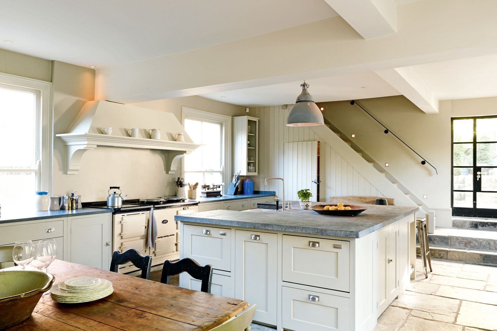 Image may contain Room Indoors Wood Interior Design Kitchen Furniture Hardwood Kitchen Island Housing and Building