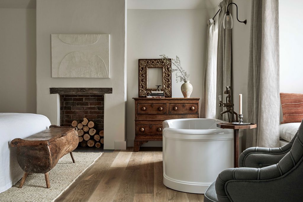 Image may contain Flooring Furniture Floor Living Room Indoors Room Wood Chair and Hardwood