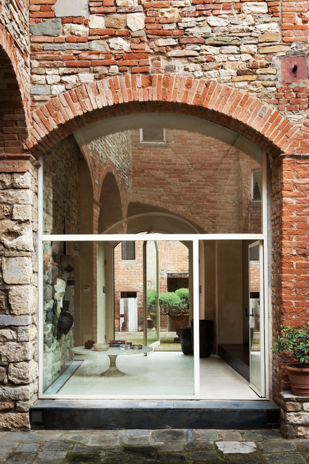 Image may contain Brick Path Walkway Door Architecture and Building