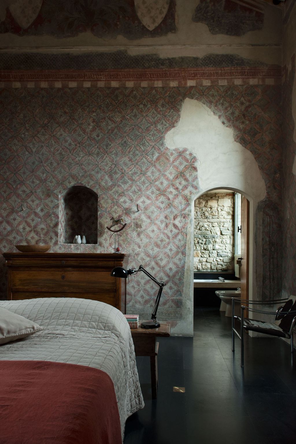 Image may contain Furniture Flooring Bed Indoors Room Bedroom Interior Design and Floor