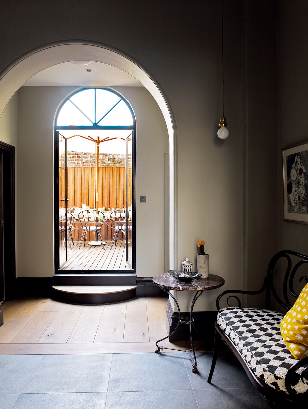 The floor of the entrance hall looking out to the terrace has been inset with stone.