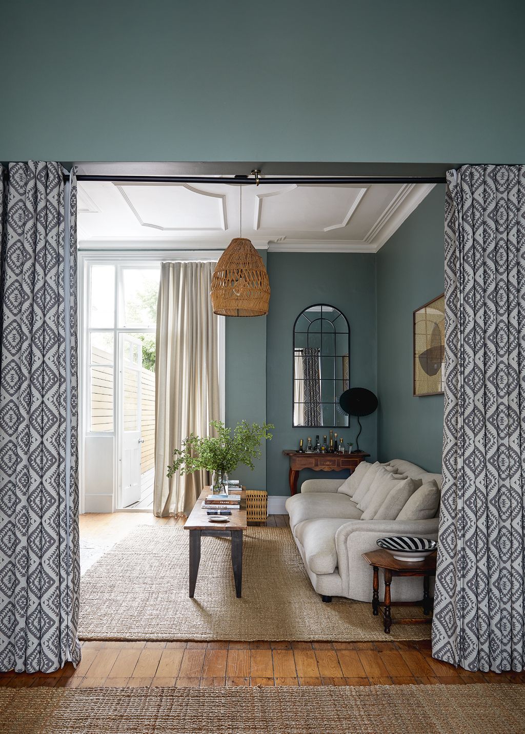 In this Victorian house by Studio Kaya geometric wool mix curtains from Peter Jones cleverly divide the openplan sitting...