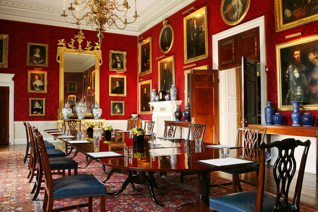 Image may contain Furniture Chair Restaurant Cafe Room Indoors Dining Table Table Dining Room and Wood