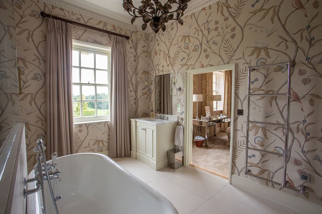 Image may contain Tub Interior Design Indoors Bathtub Floor Room and Flooring