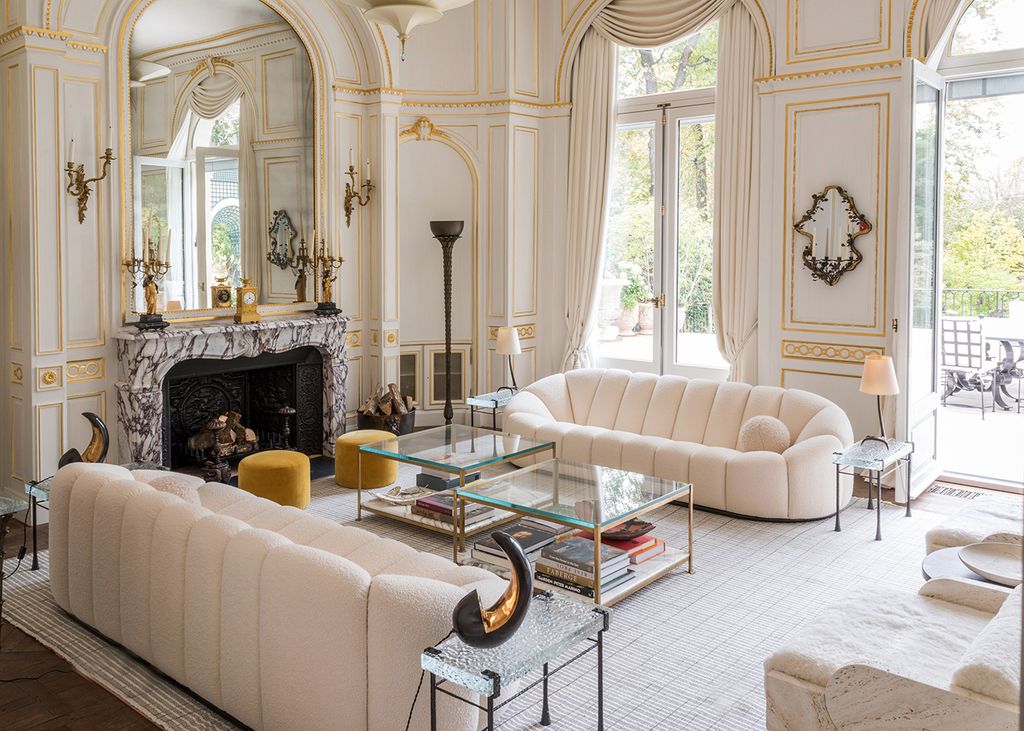 Image may contain Furniture Living Room Room Indoors Rug Table Interior Design and Fireplace