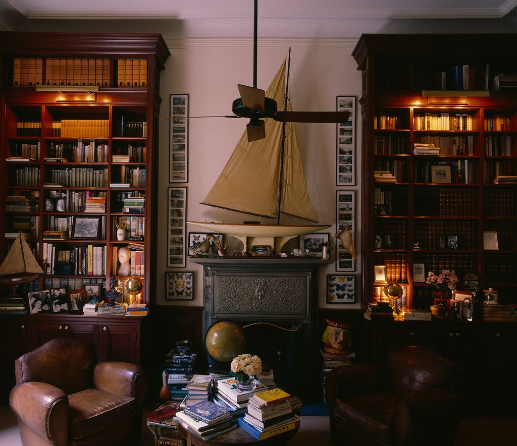 Image may contain Furniture Bookcase Shelf Living Room Indoors Room Couch and Interior Design