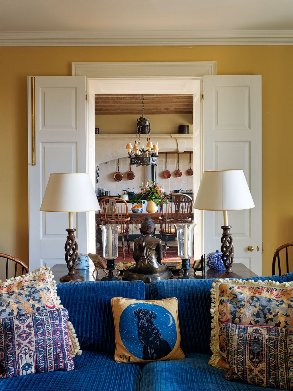 Image may contain Lamp Table Lamp Couch Furniture Home Decor Living Room Indoors and Room