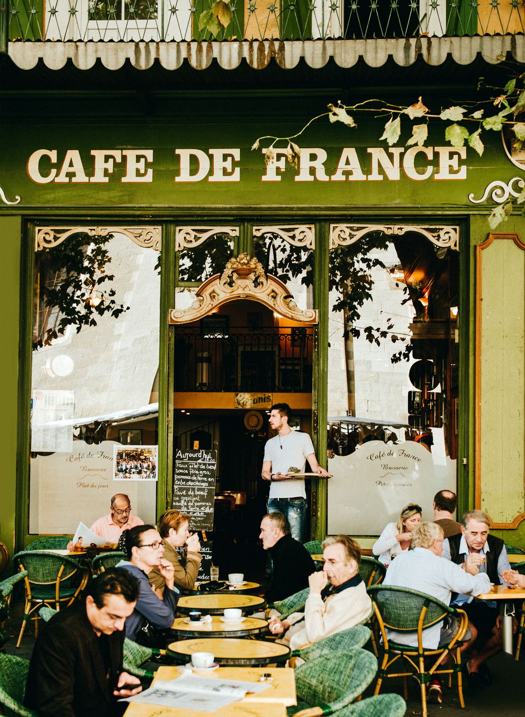 Image may contain Restaurant Furniture Chair Human Person Cafe Cafeteria Food Court and Food