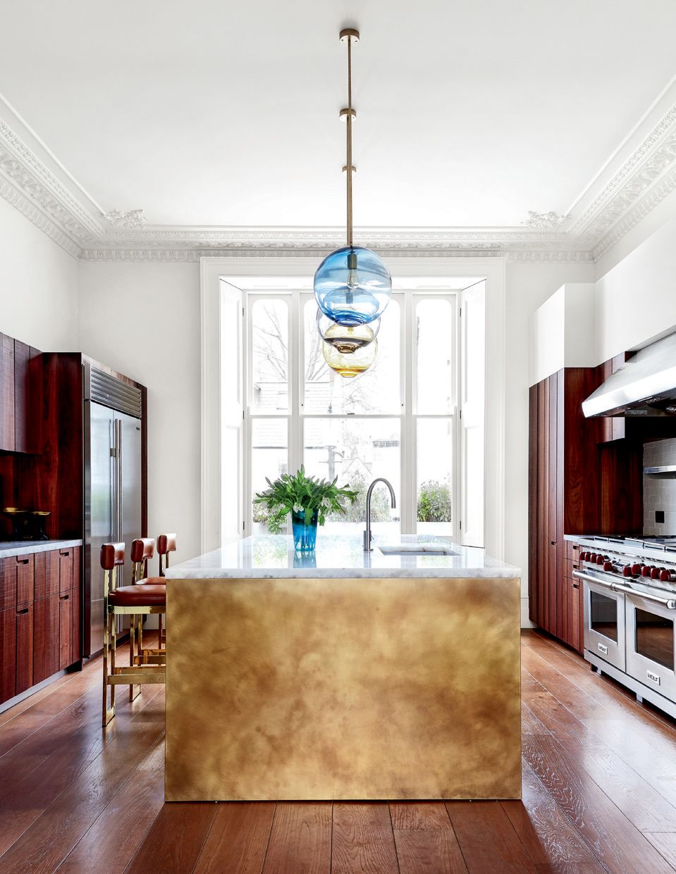 Image may contain Flooring Wood Hardwood Indoors Room Floor Interior Design Kitchen Island Kitchen and Living Room