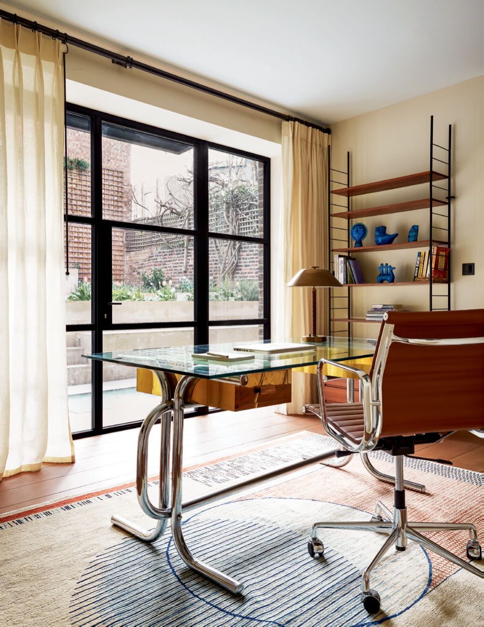 Image may contain Furniture Living Room Room Indoors Table and Rug