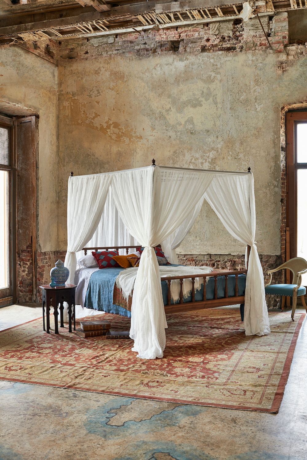 Image may contain Flooring Furniture Wood Floor Hardwood Home Decor Interior Design Indoors Rug and Bed