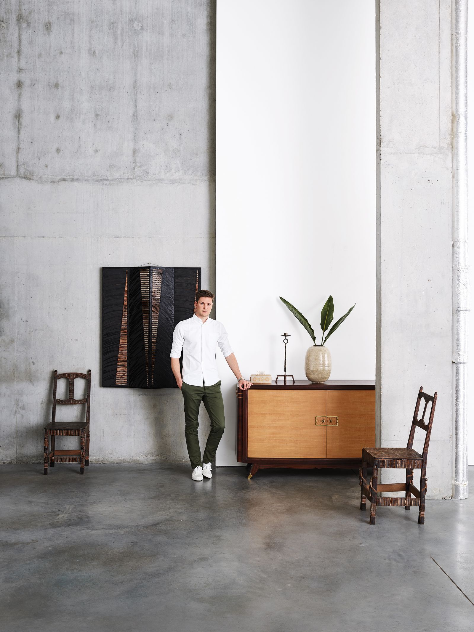 Image may contain Furniture Human Person Tabletop Indoors Interior Design Chair Wood Sideboard Room and Floor