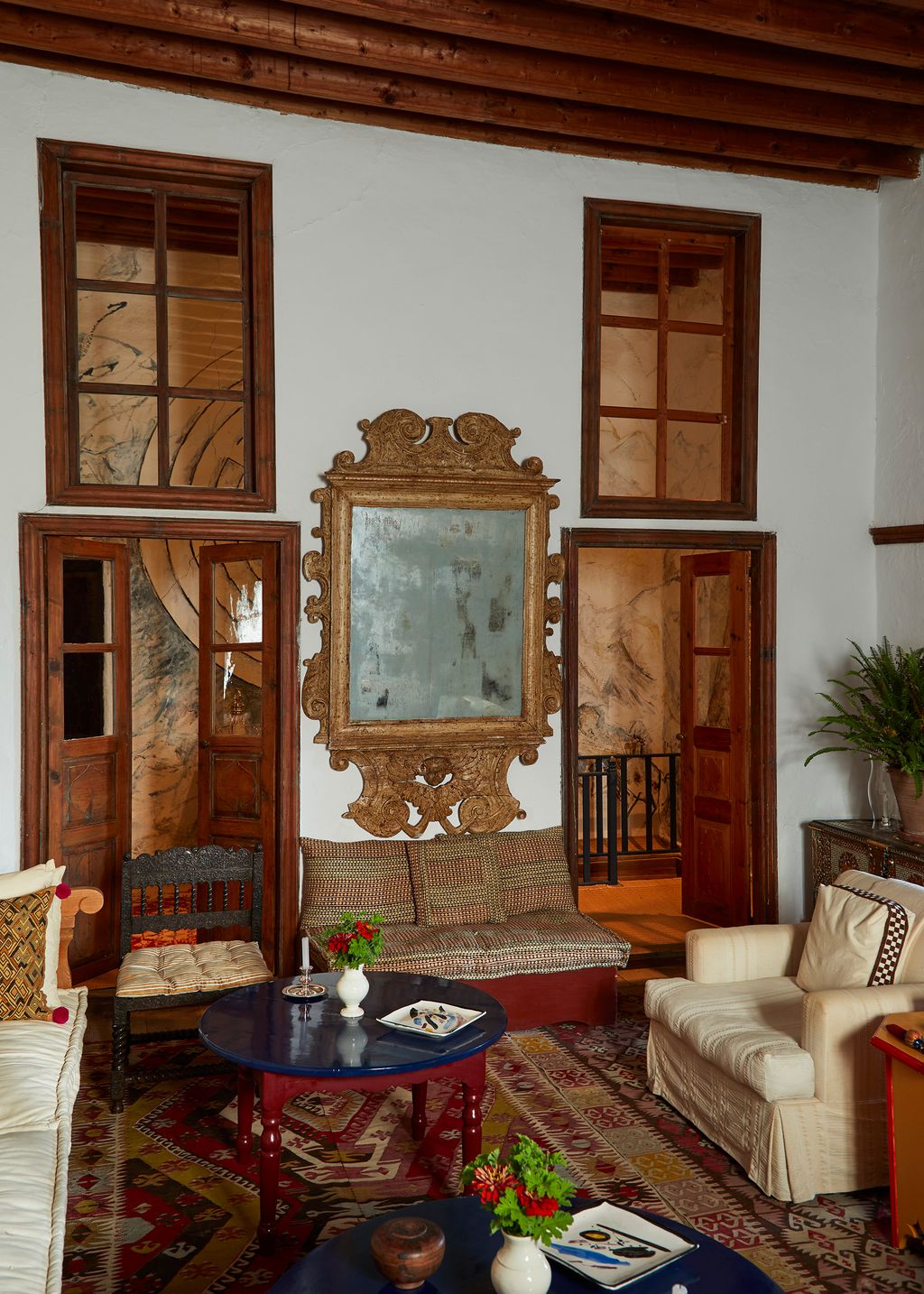 Image may contain Furniture Living Room Room Indoors Couch Wood Interior Design Table and Rug