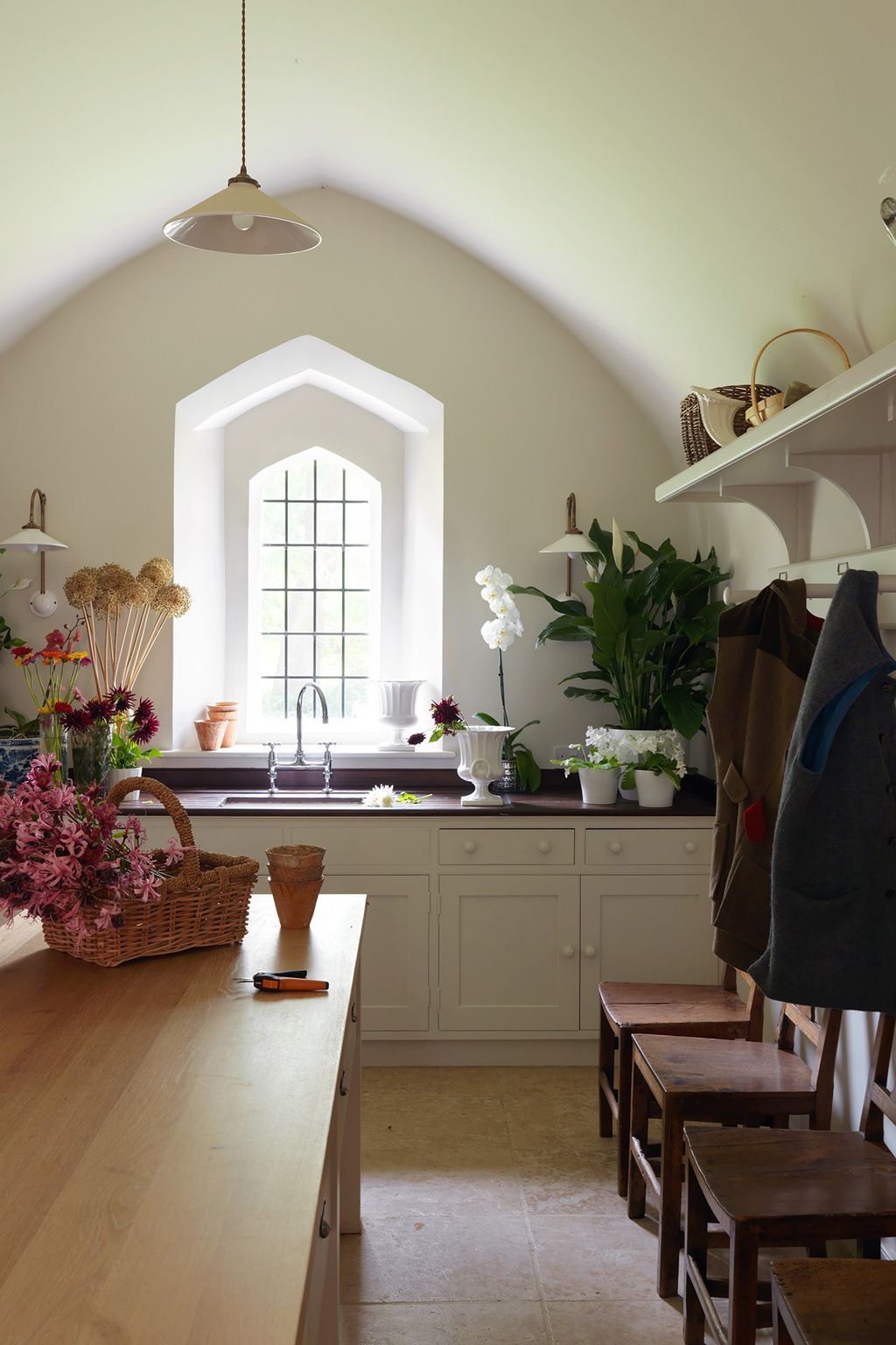 Image may contain Interior Design Indoors Room Plant Flooring Living Room Wood Flower and Blossom