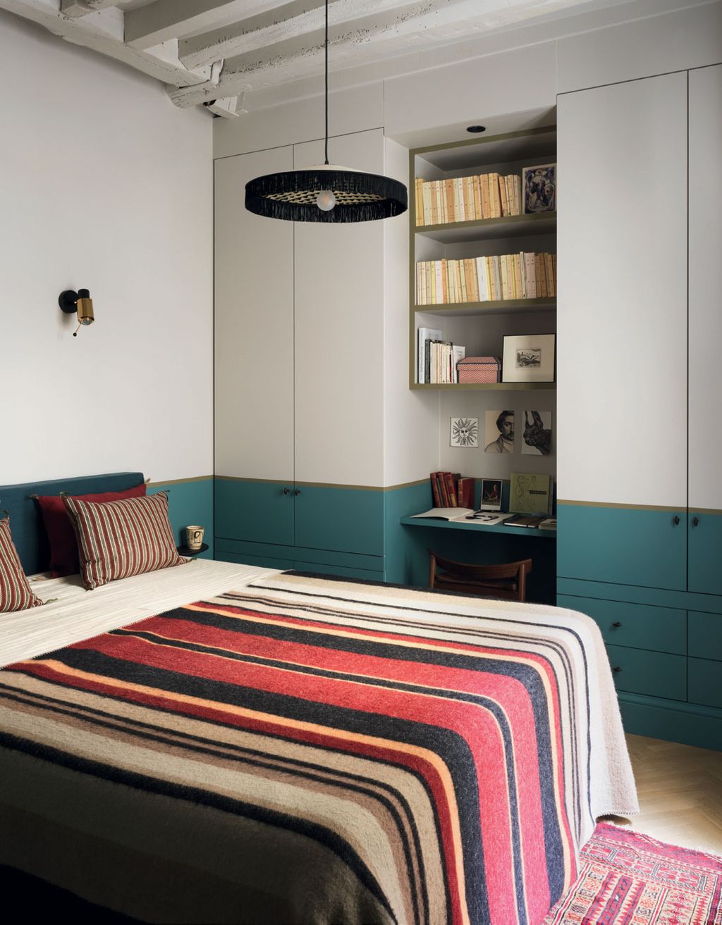 Image may contain Indoors Room Bedroom Furniture Bed Dorm Room and Interior Design