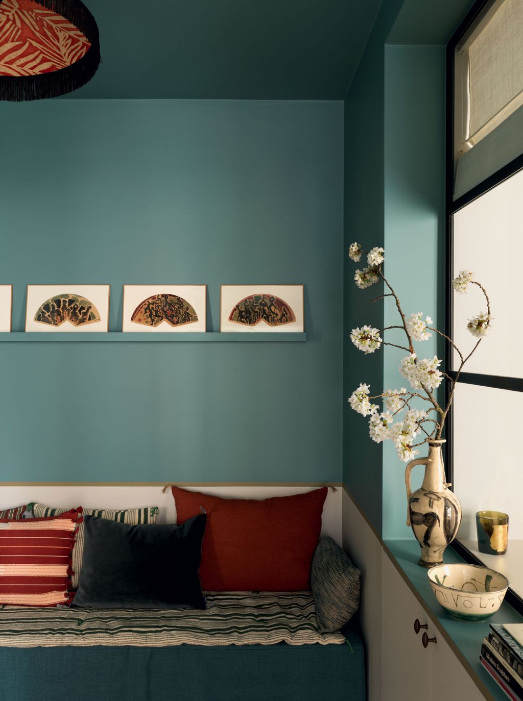 Image may contain Living Room Room Indoors Interior Design Furniture Couch Art Flower Plant Blossom and Bed