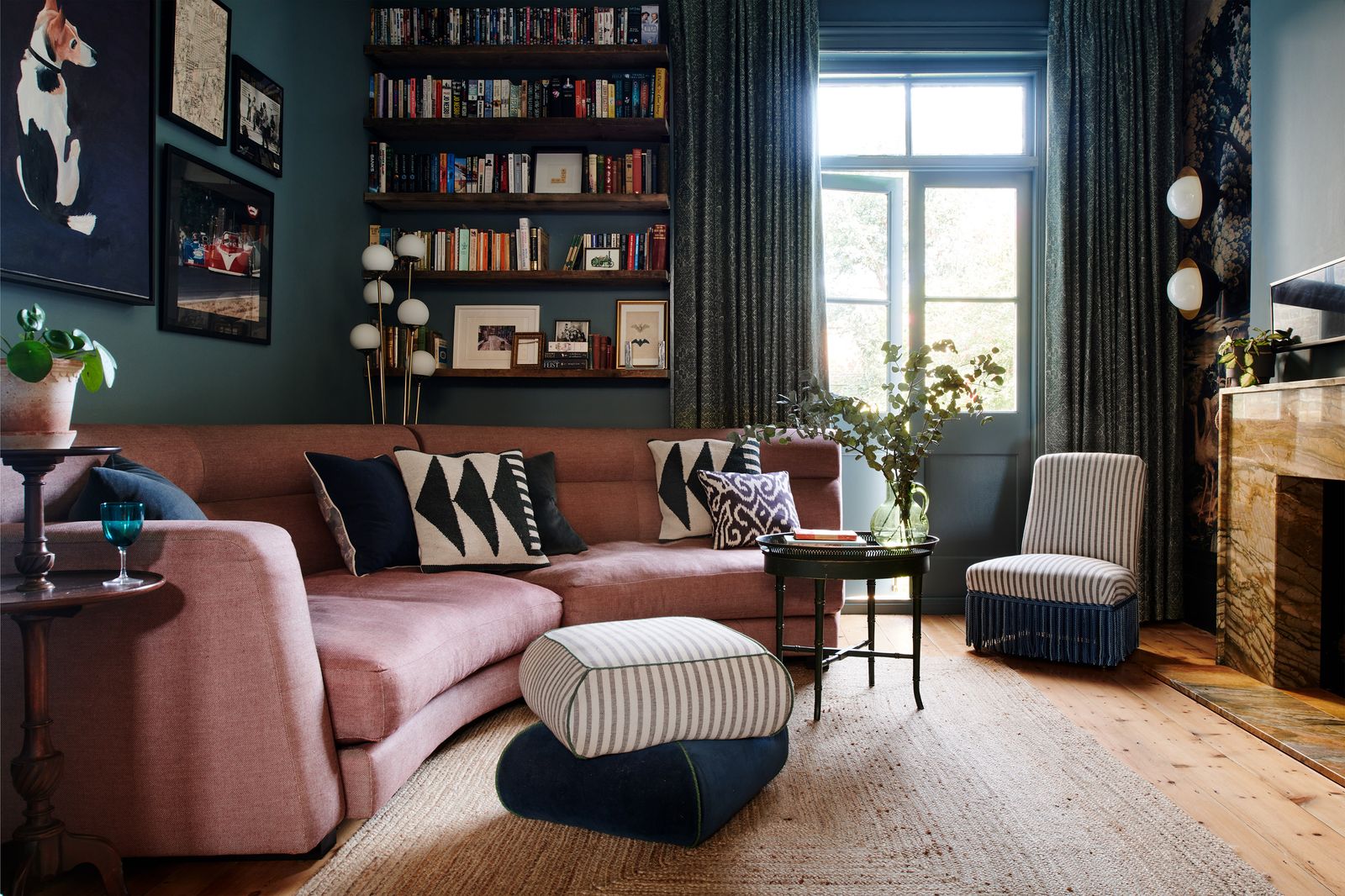 Image may contain Furniture Living Room Indoors Room Couch Table Interior Design and Coffee Table