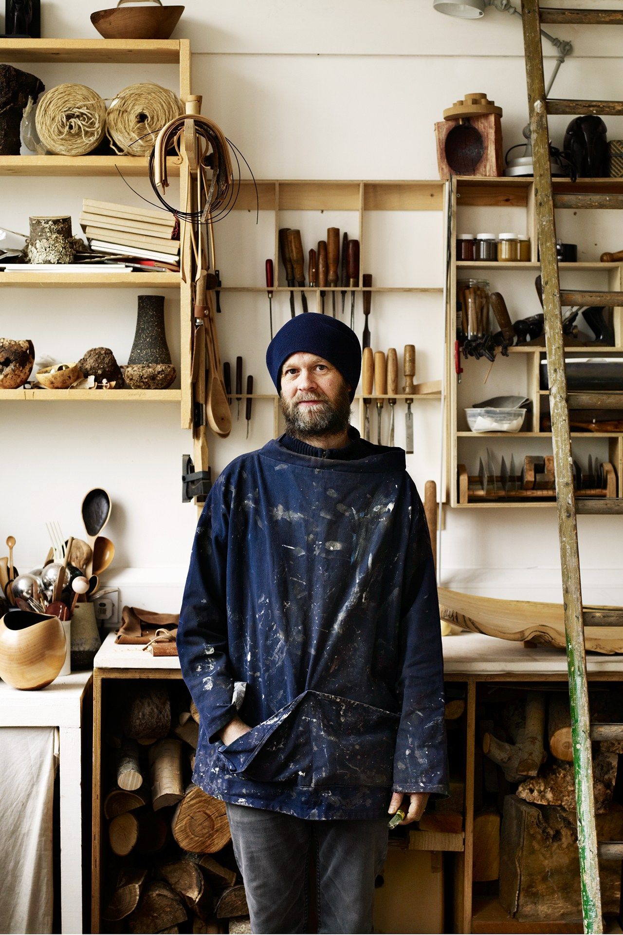 Image may contain Shelf Clothing Apparel Jacket Coat Human Person Wood Furniture Cutlery Spoon and Overcoat