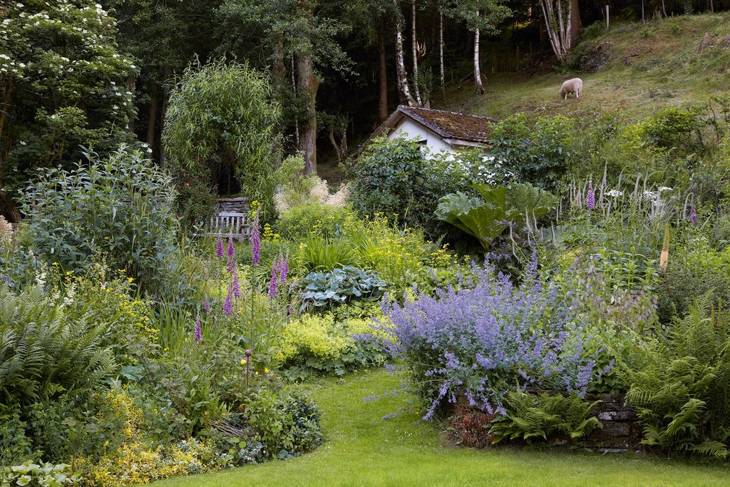 Image may contain Plant Outdoors Garden Grass Arbour Animal Sheep Mammal Vase Pottery Potted Plant and Jar