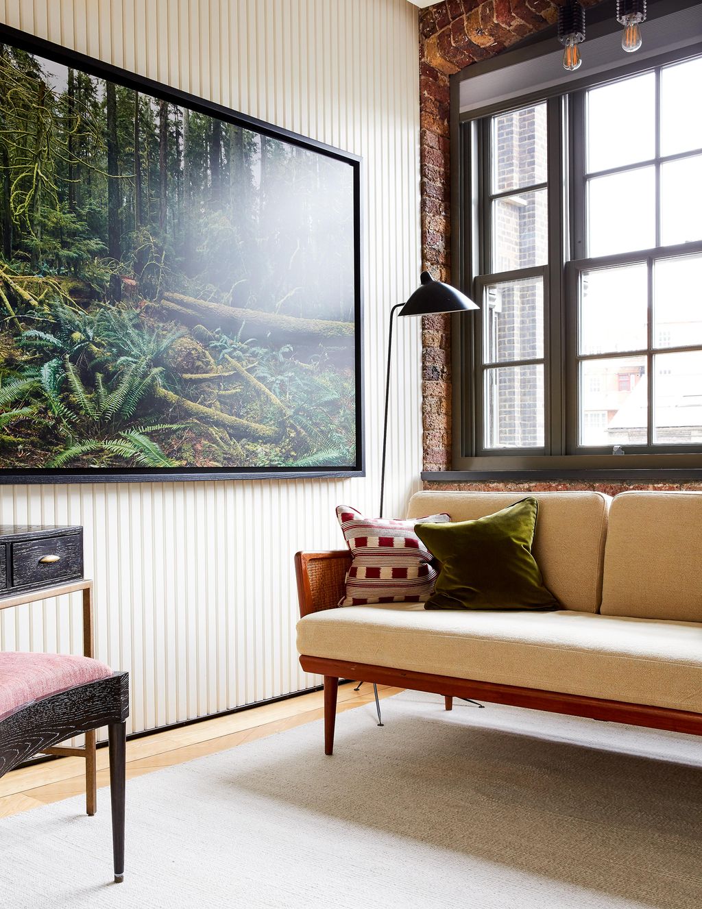 Image may contain Furniture Living Room Room Indoors Home Decor Table Cushion Pillow Electronics and Monitor