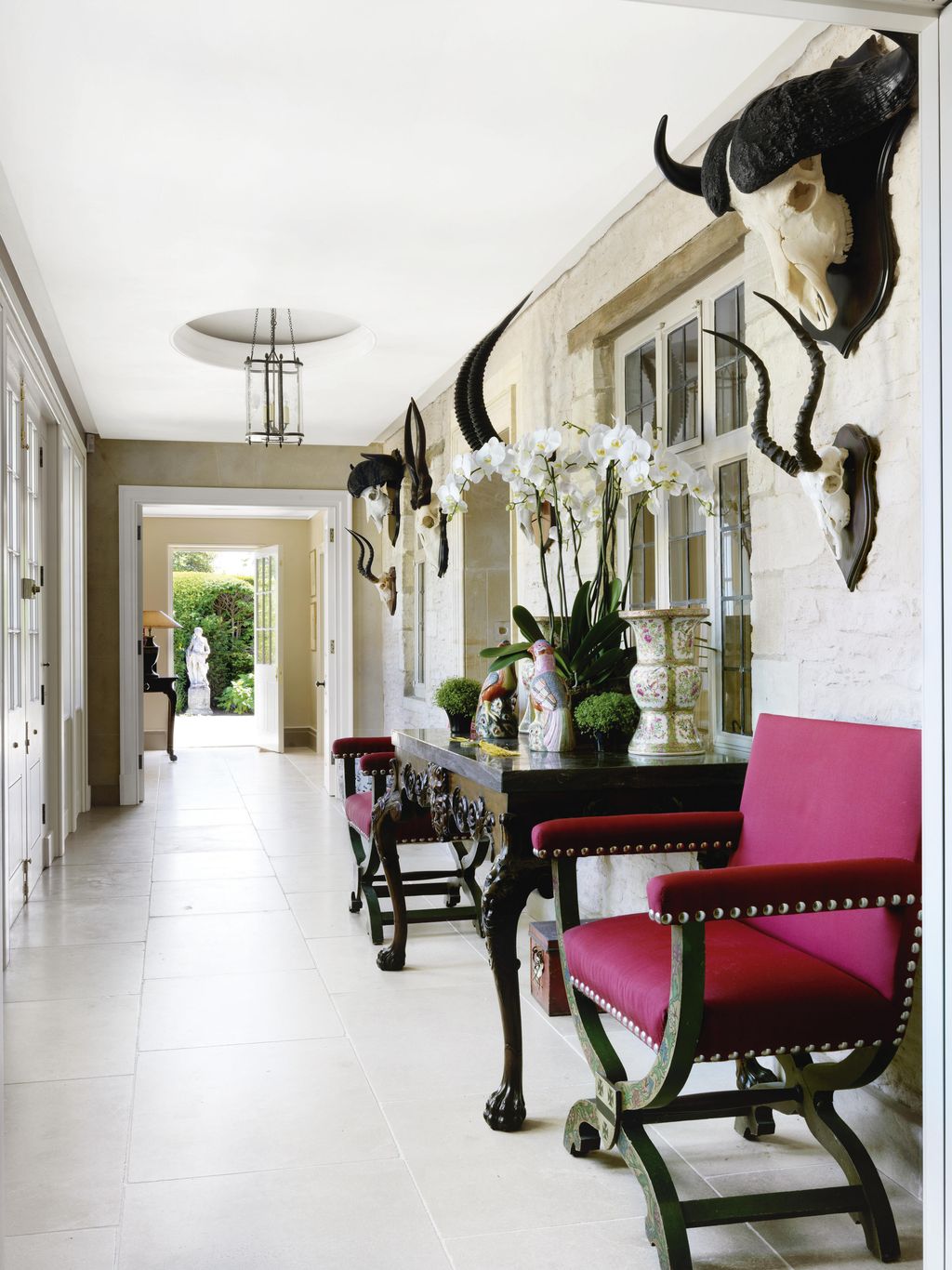 Joanna also found the Irish console table that stands in the hall between a pair of Xframe chairs at Christie's.