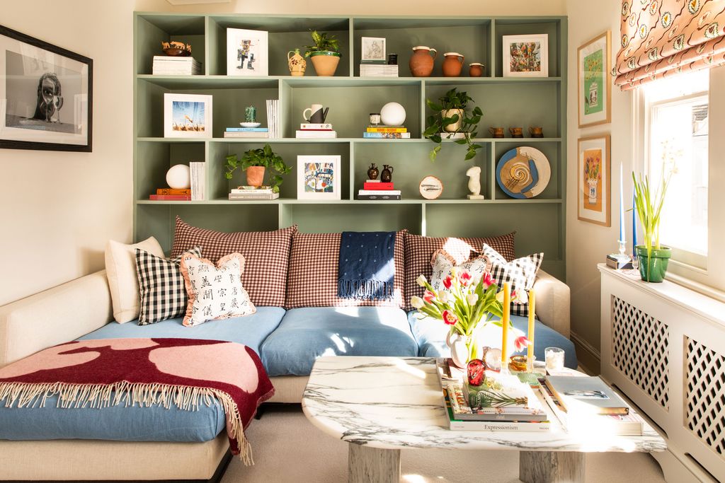 Image may contain Furniture Couch Living Room Indoors Room Cushion and Table