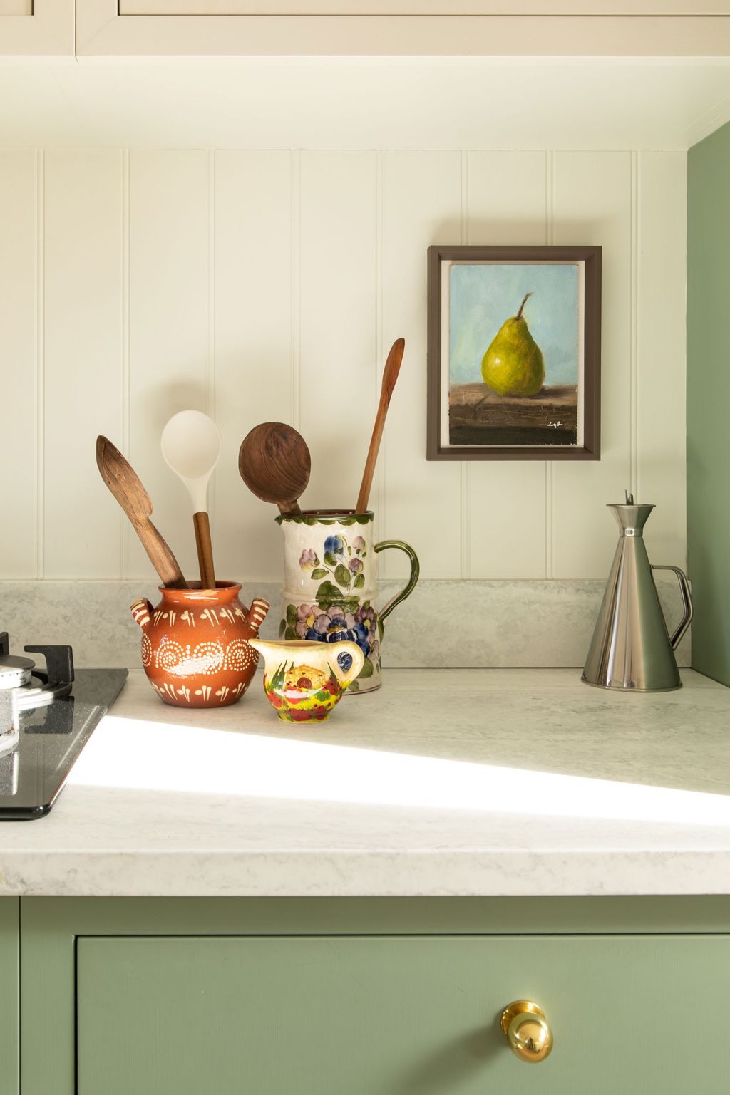 The darker 'Slate II' is also on the walls in the kitchen. The oil painting was sourced on Etsy.