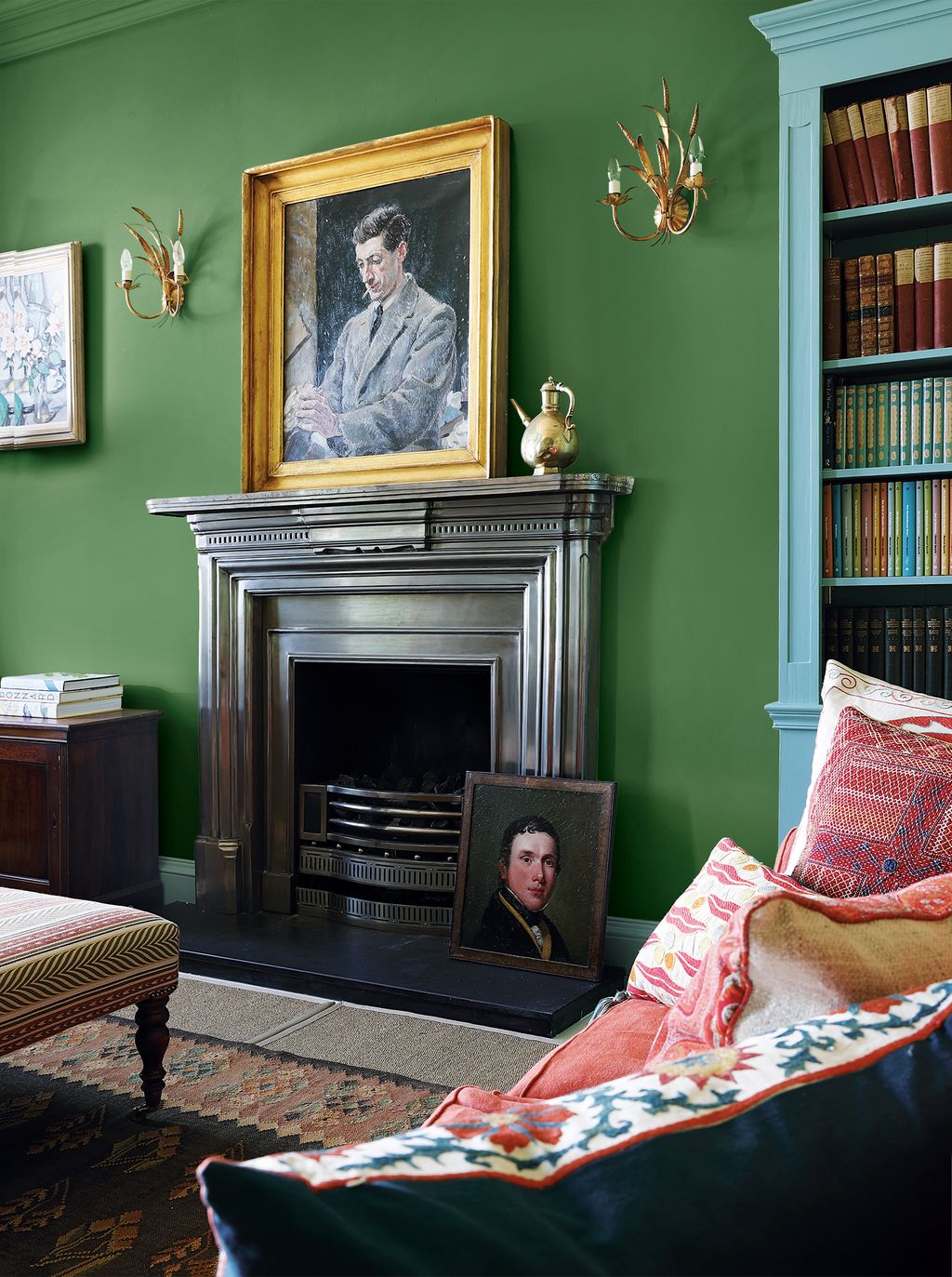 Image may contain Furniture Human Person Cushion Fireplace Indoors Living Room Room Home Decor Manolete and Pillow