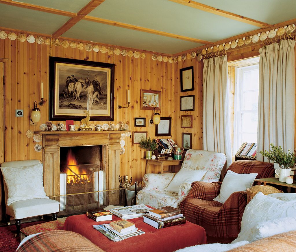 Image may contain Living Room Room Indoors Furniture Couch Interior Design Hearth and Cushion