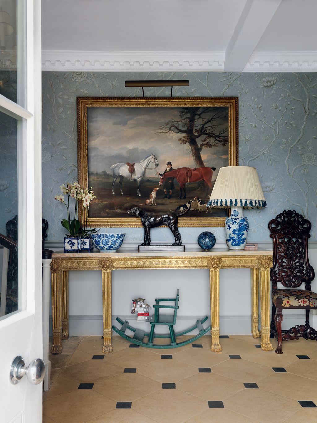 Image may contain Flooring Living Room Room Indoors Interior Design Wood Lamp Table Lamp Furniture and Floor