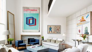 Image may contain Furniture Living Room Room Indoors Table Interior Design Couch Coffee Table Rug and Cushion