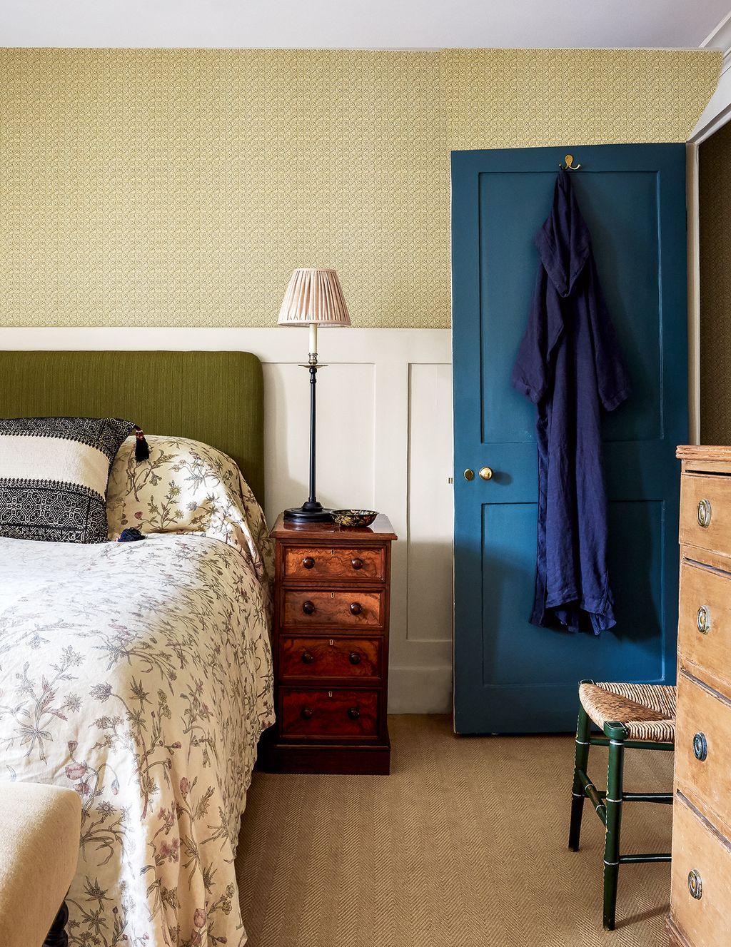 Robert Kime furnishings create a restful mood in the main bedroom his ‘Gaia Millet wallpaper and a bedcover in ‘Meadow...